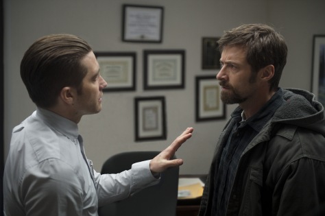 Wilson Webb/Warner Bros. Pictures Detective Loki (Jake Gyllenhaal) tries to calm Keller Dover (Hugh Jackman).
